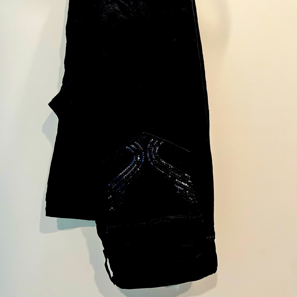 NYDJ black jeans with embellished pockets. Slim cut size 12